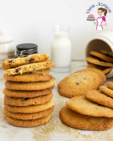 A stack of chocolate chip cookies on a table.