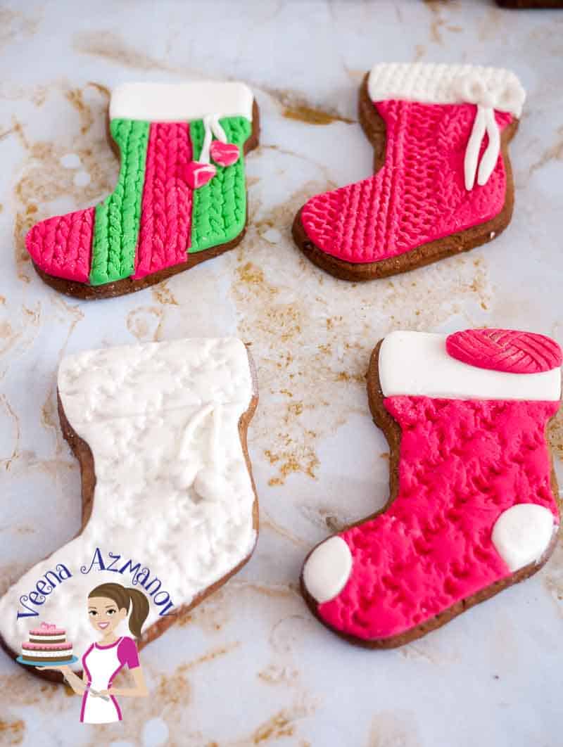 Different shapes of decorated Christmas cookies.