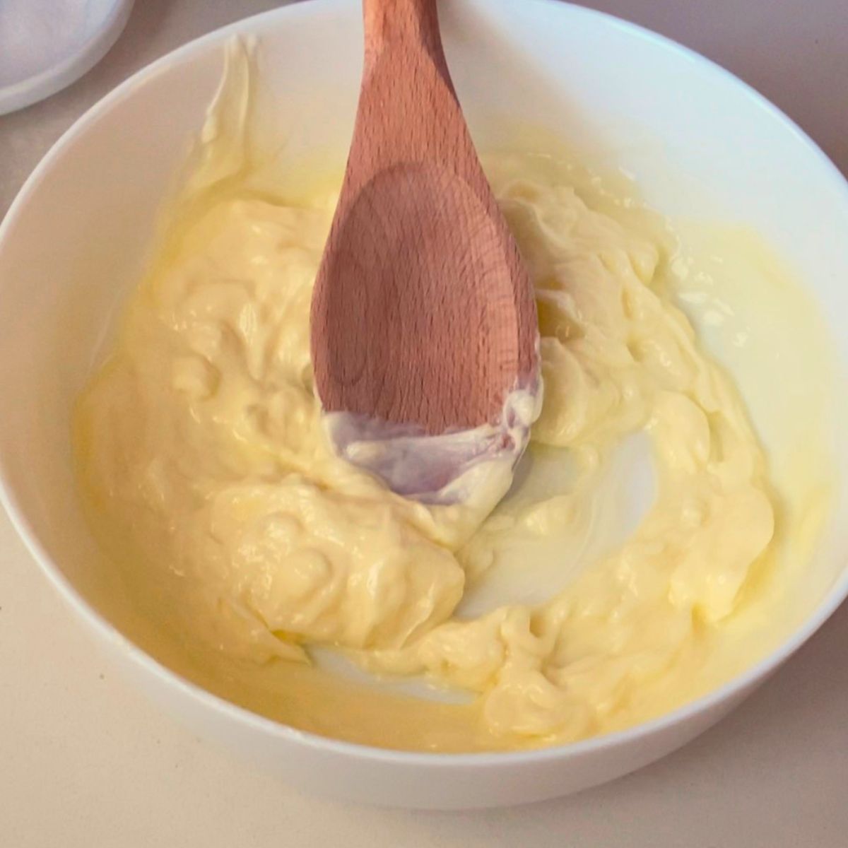 A bowl with soft creaming butter.