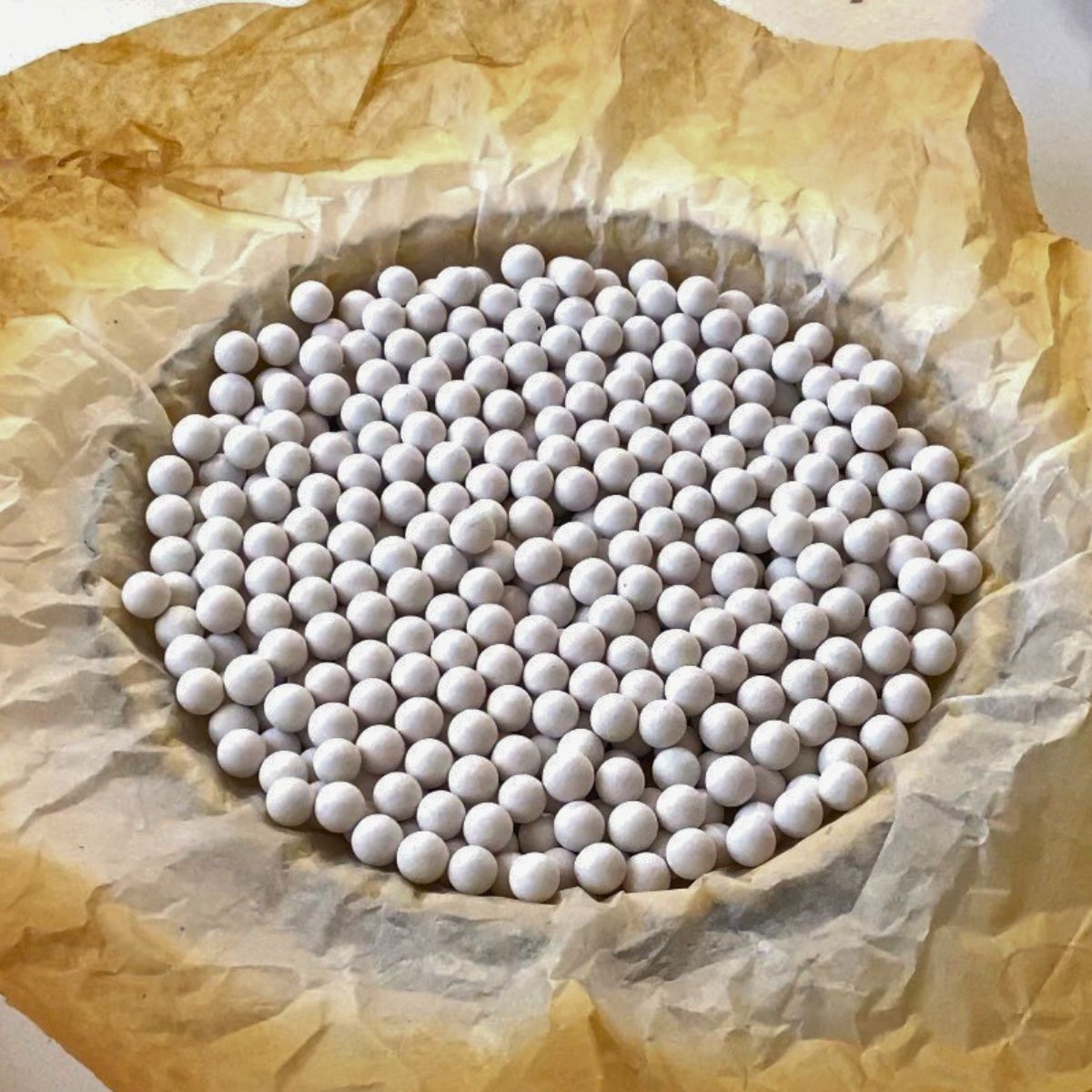 Baking a pie crust with pie weights.