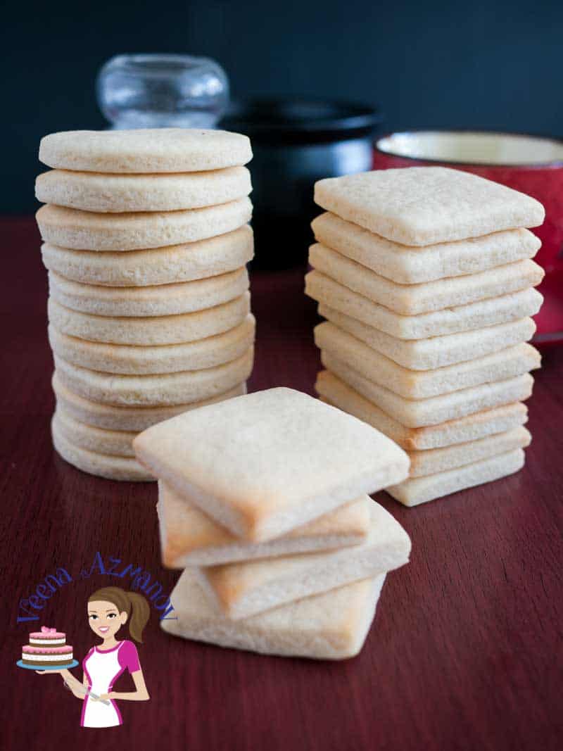A stack of sugar cookies on a table.