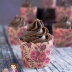 A cupcake with Chocolate frosting.