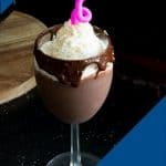 A wine glass with eggnog