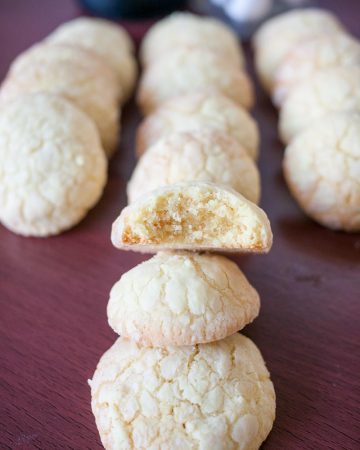 A row of butter cookies on a table.