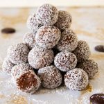 Rolling chocolate coconut truffle mixture into balls