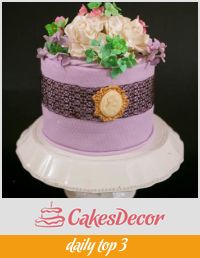 A wedding cake designed lavender color with lace.