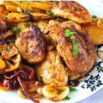 A plate with shawarma sheet pan chicken.