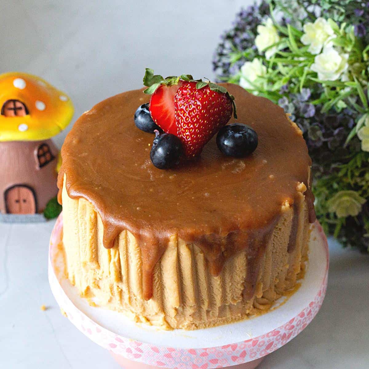 A cake with butterscotch drip.