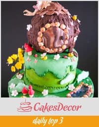 A cake decorated to look like a woodland fairy house.