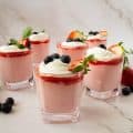 Six glasses with strawberry mousse