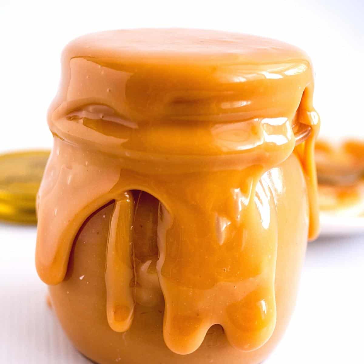 Caramel overflowing in a mason jar.