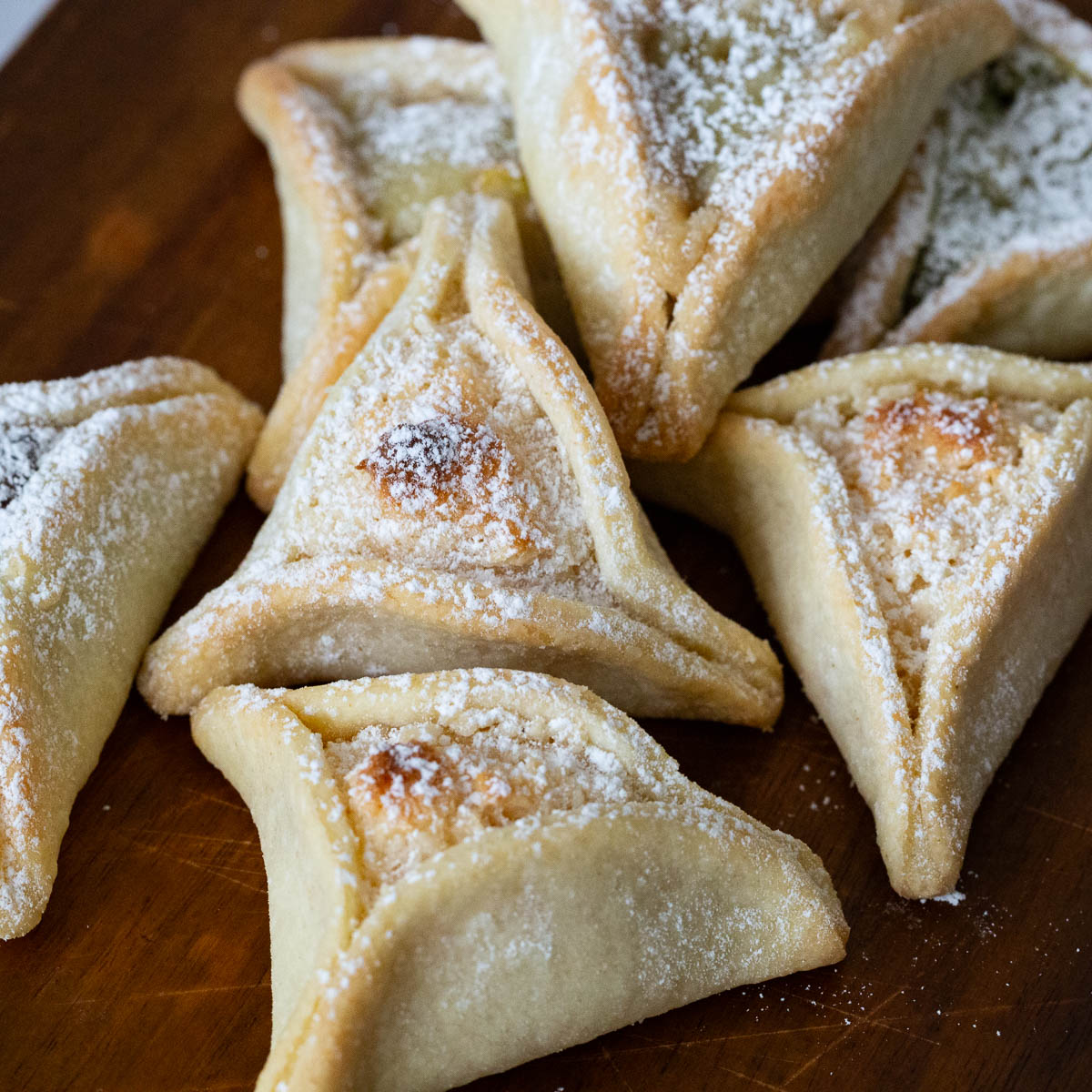 Halva hamantaschen cookies on the table.