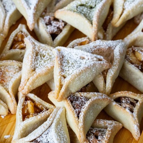 Stack of purim cookies on the table.