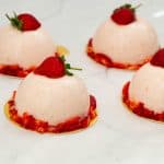 A few dome entremets on the table.