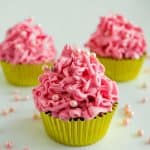 Frosted cupcakes on the table.