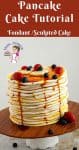 A decorated cake designed like a stack of pancakes.