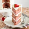 A slice of cake on a white plate