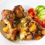 A plate with chicken in a sheet pan.