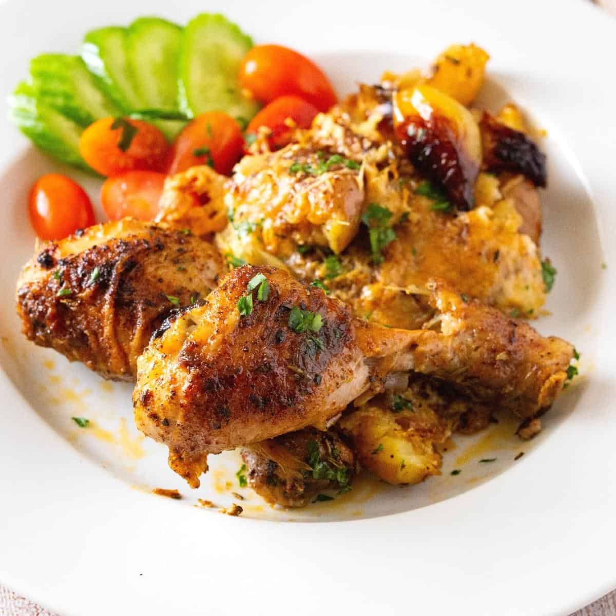 A plate with sheet pan chicken.