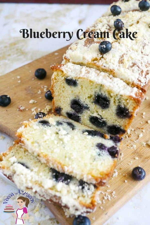 Slices of blueberry cake on a wooden board.