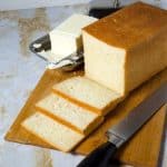Sliced loaf of bread on a wooden board