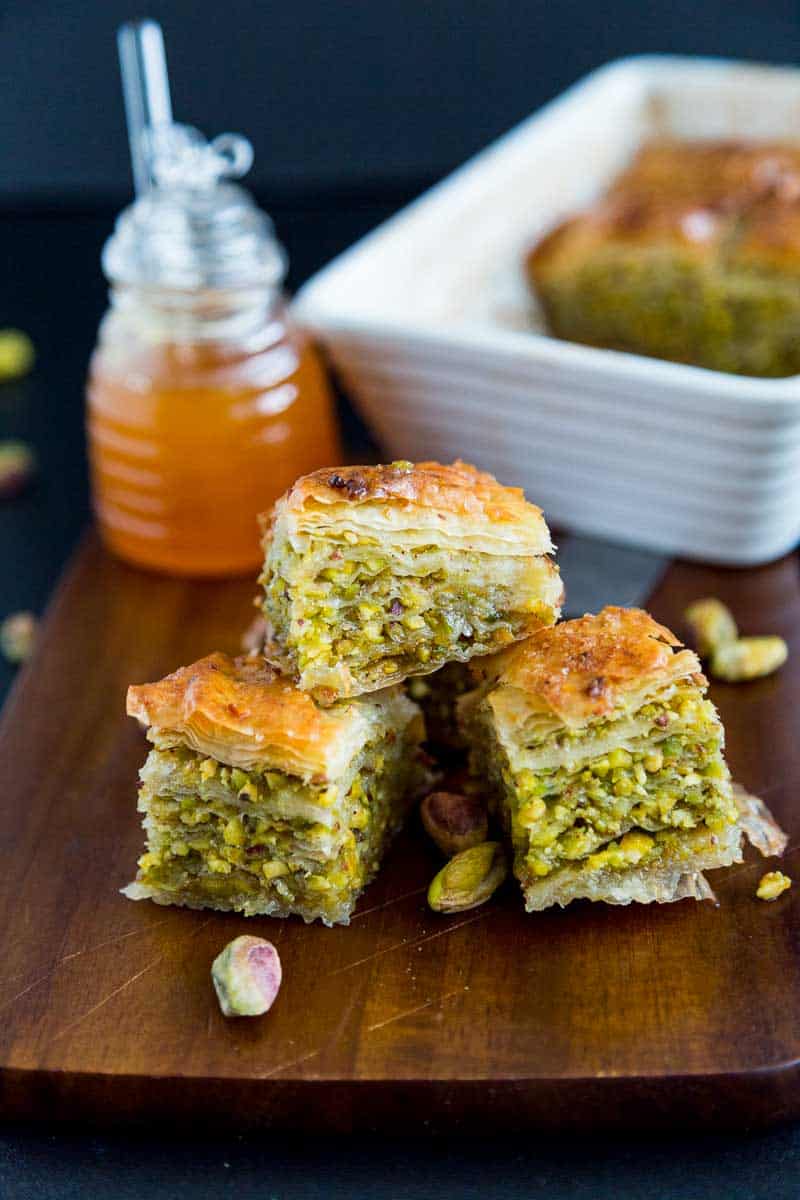 Three pieces of baklava on a table.