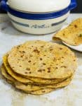 This whole wheat sweet potato chapati or flatbread is so versatile you can have it for breakfast, lunch, and dinner. This simple, easy and effortless recipe makes the softest sweet potato flatbread ever. Combined with onions and herbs means you can have it on its own or as a bread with your main course.