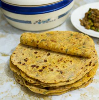 This whole wheat sweet potato chapati or flatbread is so versatile you can have it for breakfast, lunch, and dinner. This simple, easy and effortless recipe makes the softest sweet potato flatbread ever. Combined with onions and herbs means you can have it on its own or as a bread with your main course.