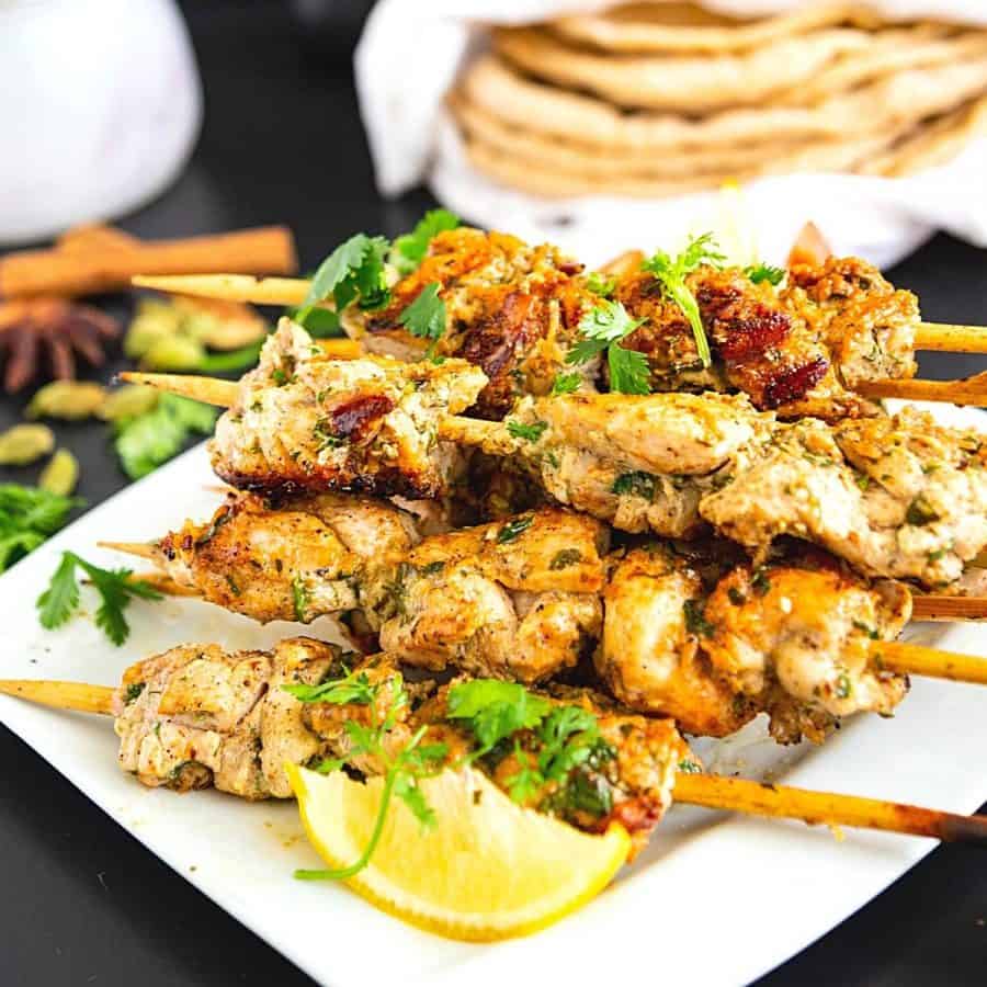 A plate with Malai chicken skewers.