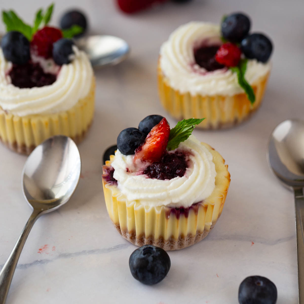 Mini cheesecakes on the table.