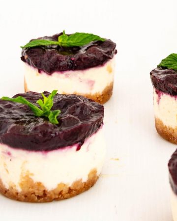 Mini cheesecakes on the table.