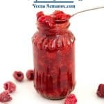Jar and spoon with fruit filling - raspberries.