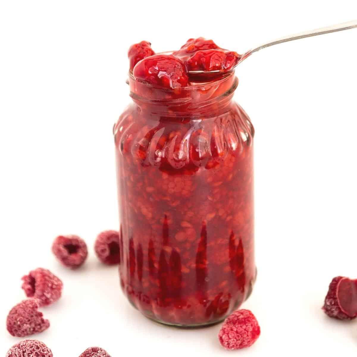 Mason jar with fruit filling - raspberries.