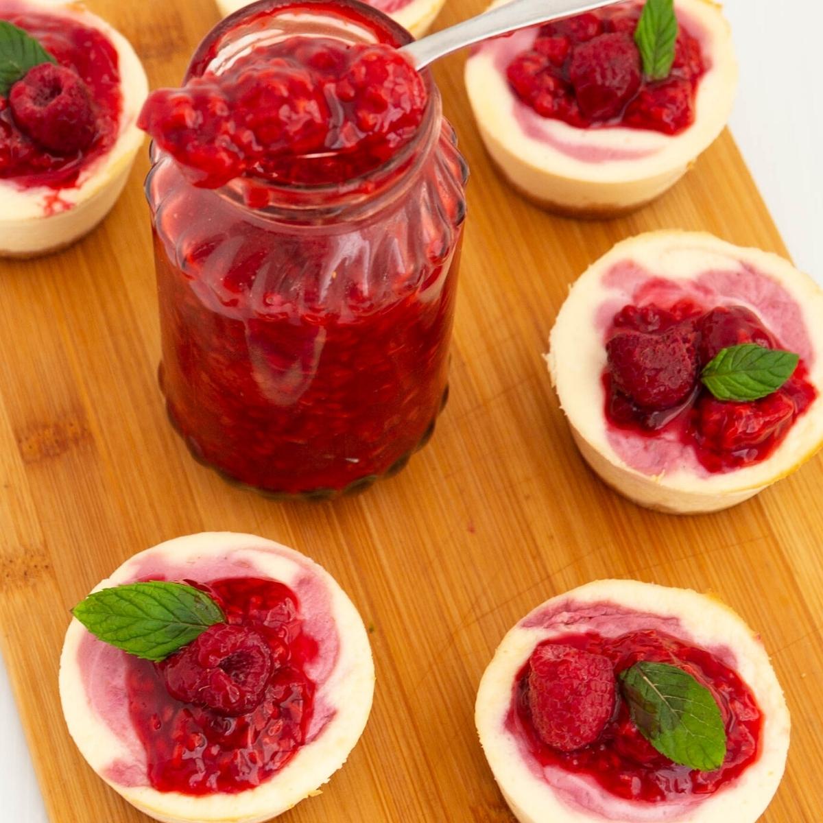 Raspberry fruit filling topped over mini cheesecakes.
