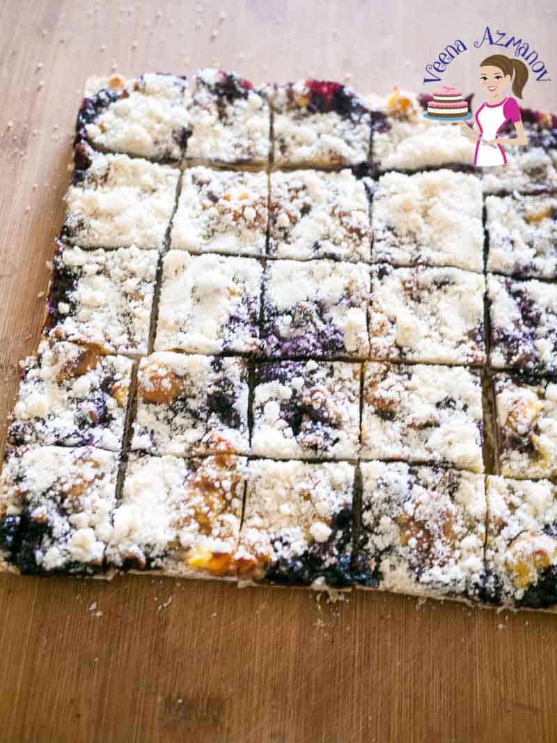 A blueberry cream cheese cake cut into squares.