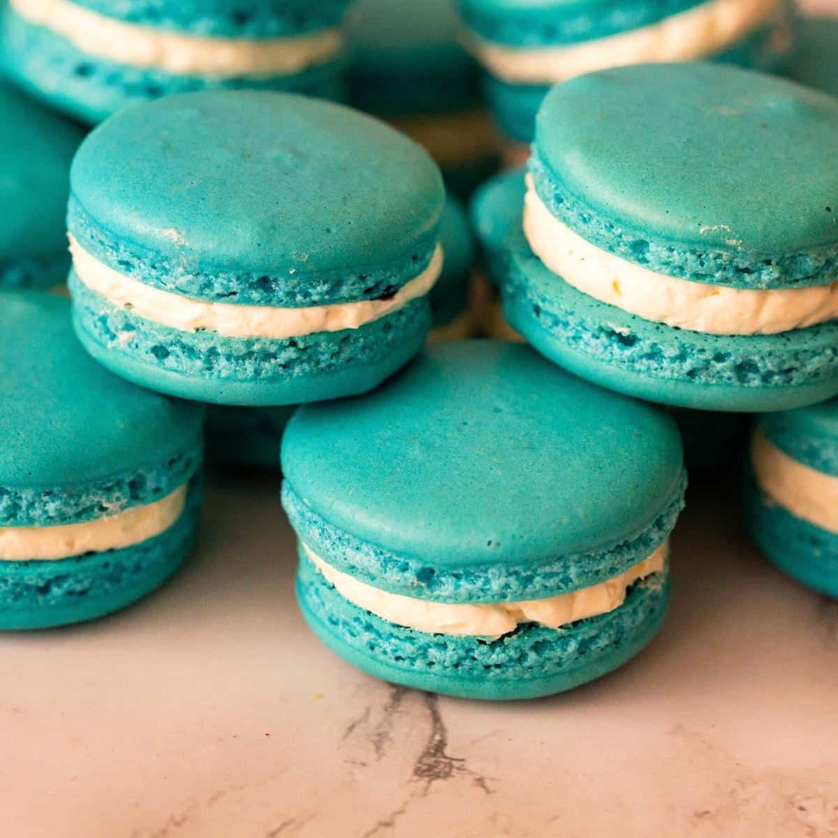 Blue macarons with blueberry filling.