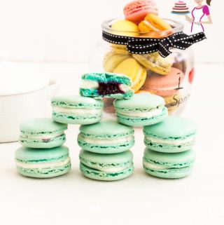 A stack of blueberry macarons on a table.