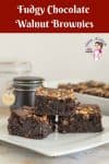 Three chocolate brownies on a plate.