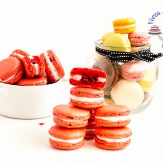 A stack of Raspberry macarons on a table.