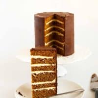 An image optimized for social media share for this classic gingerbread cake recipe with vanilla buttercream and chocolate ganache for an elegant celebration cake.