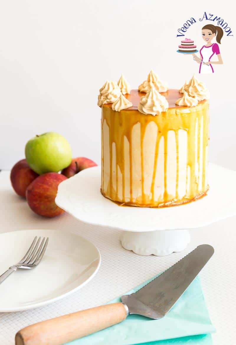 A caramel apple cake with caramel buttercream on a stand.