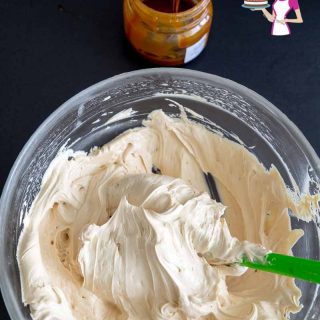 A bowl of caramel frosting.