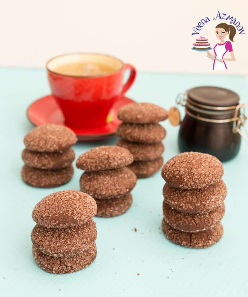 Soft, crisp and delicate these chocolate shortbread cookies just melt in the mouth. Made with just five simple ingredients and five minutes to mix these cookies get done in less than 20 minutes. No need to chill the dough and no special equipment but just a bowl and a whisk is all you need. An image optimized for social sharing for these chocolate shortbread cookies made with just six simple ingredients and five minutes to mix. The best shortbread cookies.