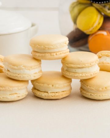 A stack of macarons on the white table