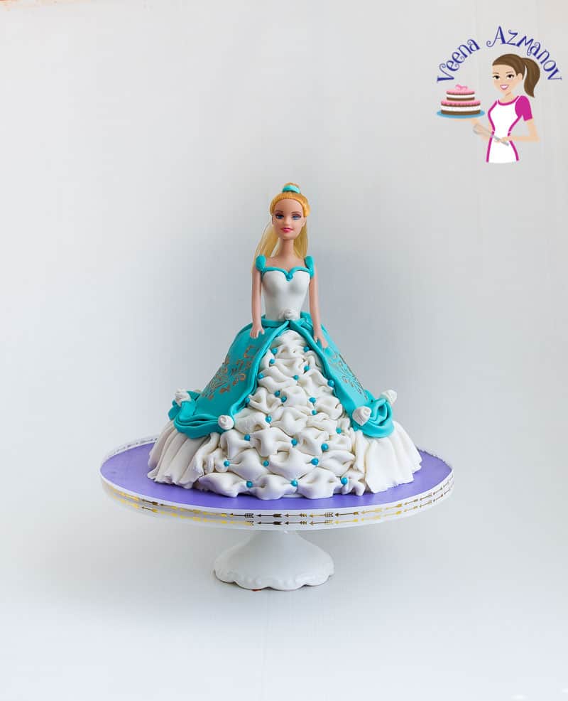 A princess cake on a stand.