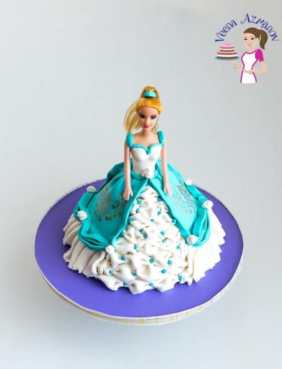 A princess cake on a stand.