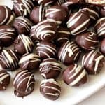 A bowl with truffles with marzipan.