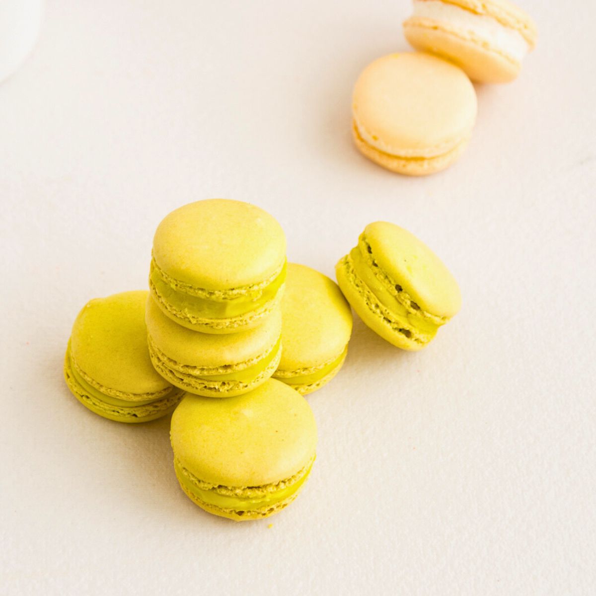 Stack of green macarons on the table.