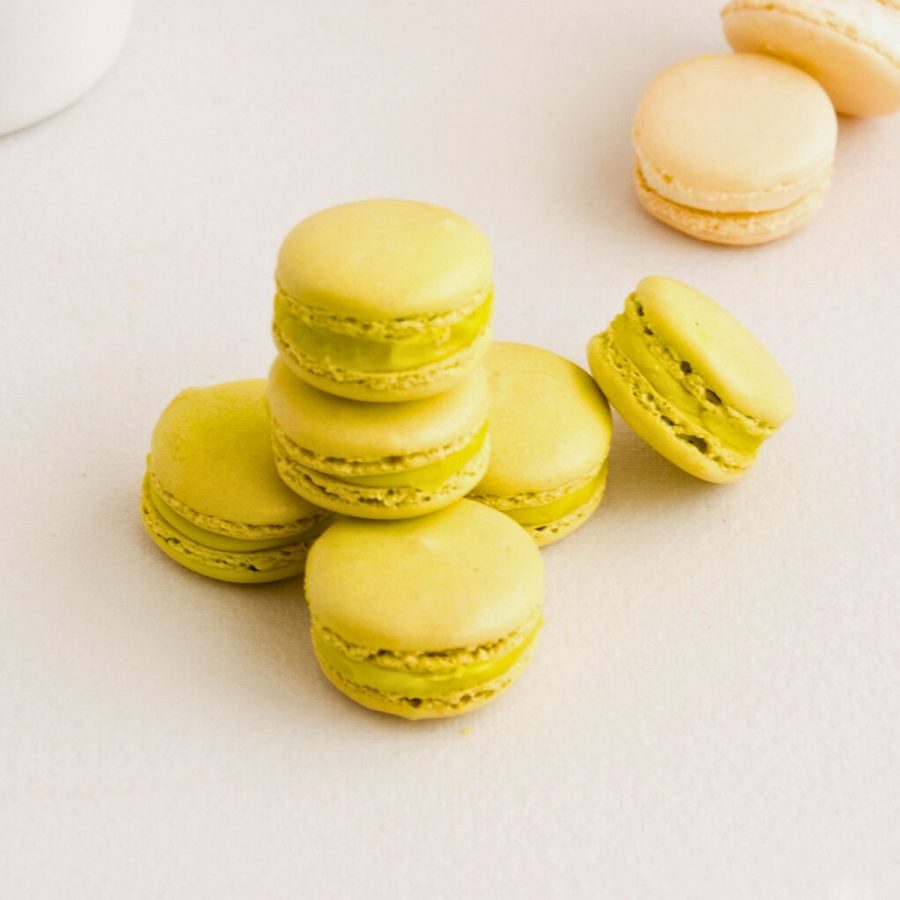 Stack of green macarons on the table.