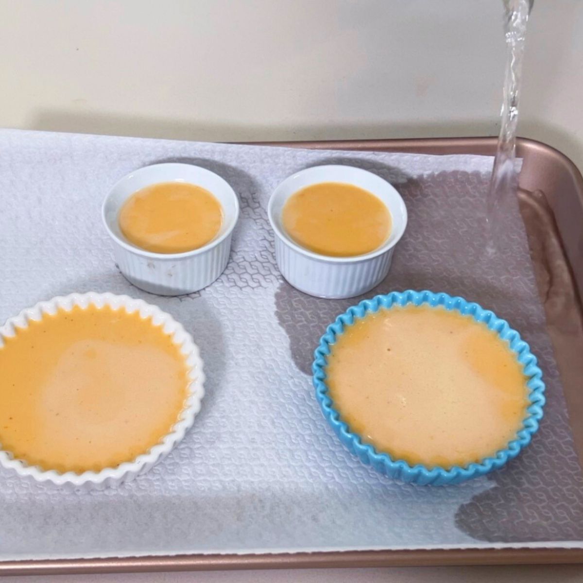 A baking tray with pumpkin creme brulee.